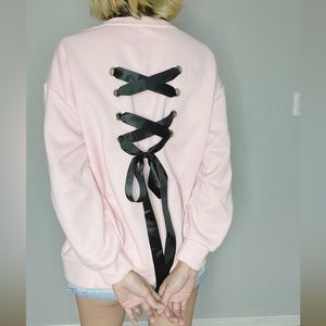 BRAND NEW! Pink sweater with black bow in the back